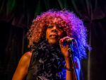 Heather A.  Needham (stage name: Coco “Cognac” Brown)